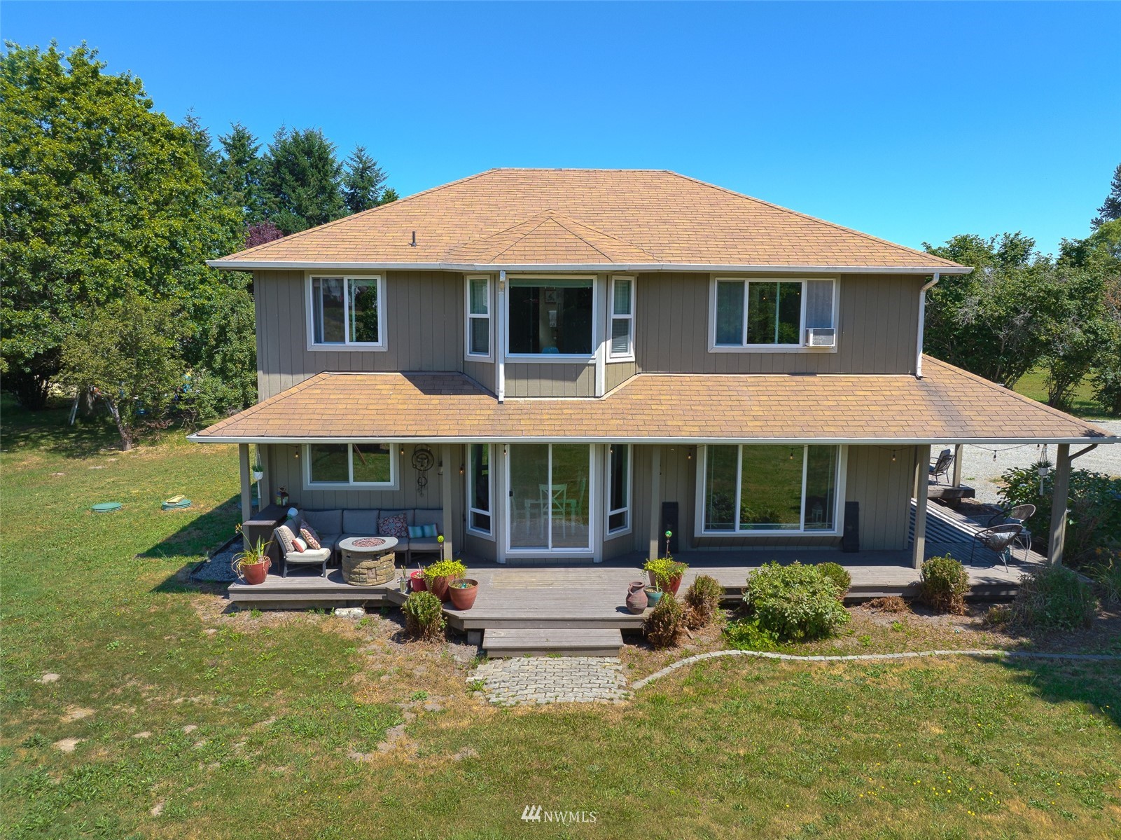 21847 Frager Road South Kent, WA 98032 - Photo 34 of 34 a view of a white house with a yard patio and a small yard