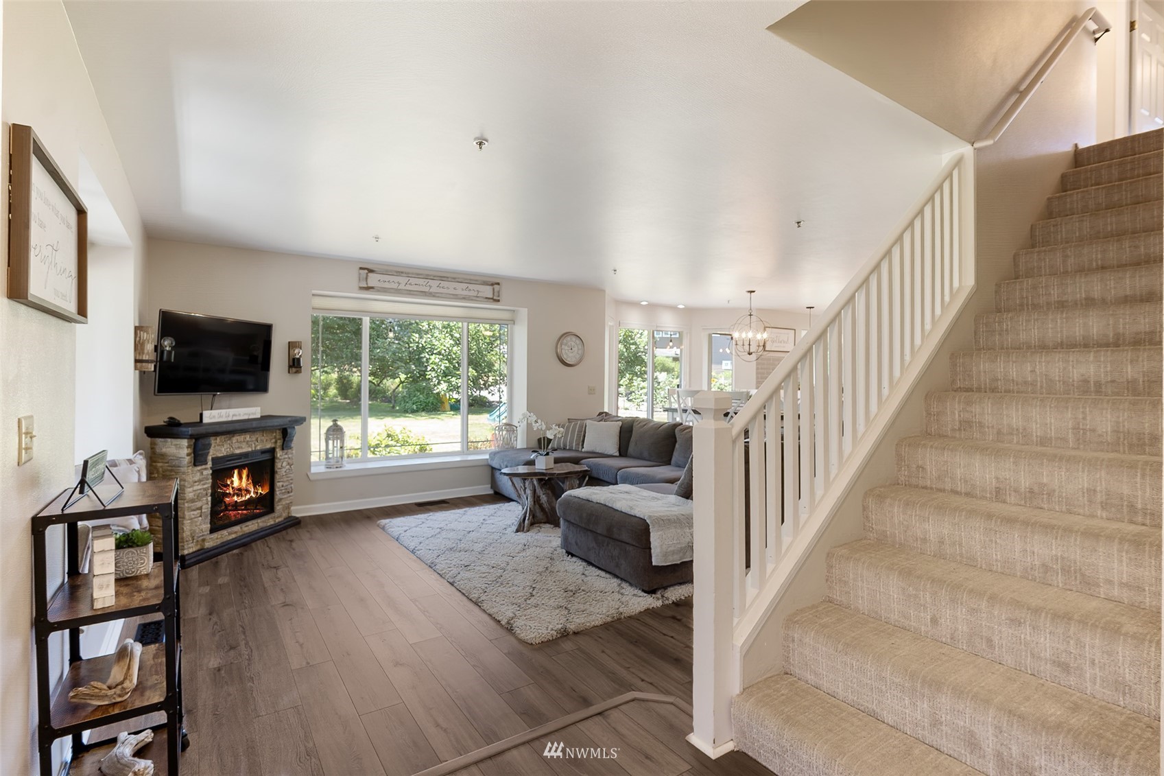 21847 Frager Road South Kent, WA 98032 - Photo 9 of 34 a living room with furniture a flat screen tv and a fireplace