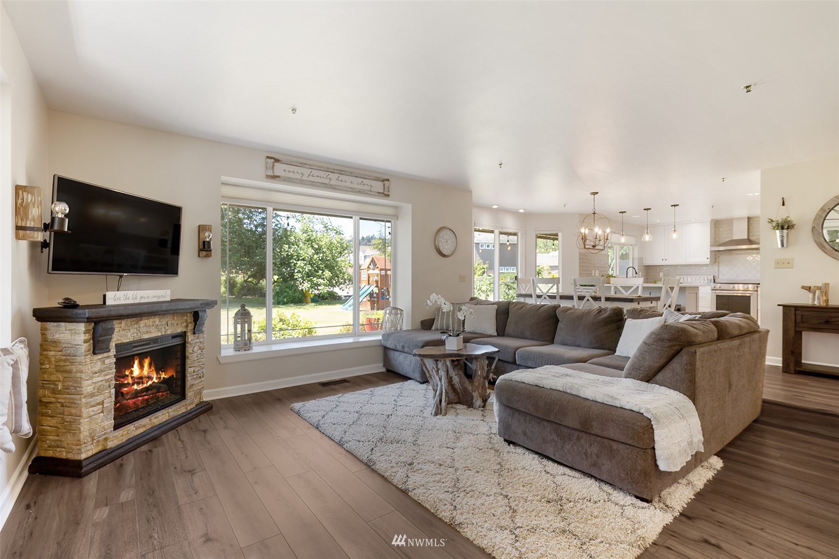 21847 Frager Road South Kent, WA 98032 - Photo 10 of 34 a living room with furniture a flat screen tv and a fireplace
