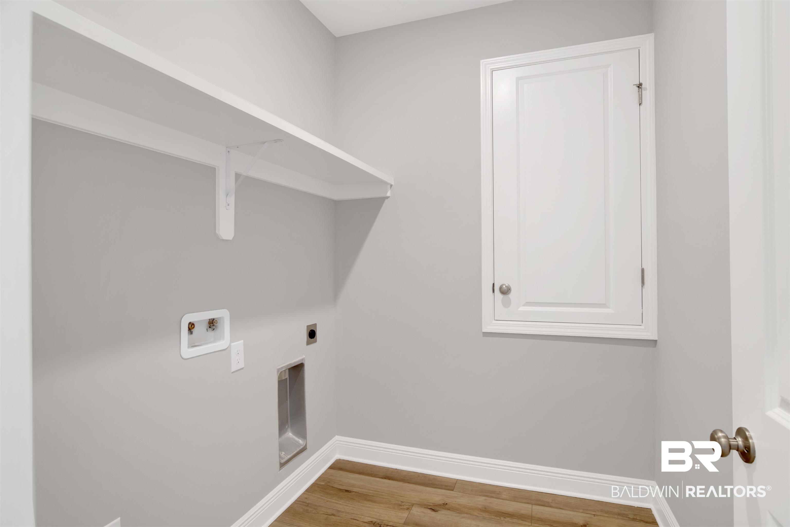 23852 Lafite Circle Daphne, AL 36526 - Photo 26 of 30 Laundry room with washer hookup, hookup for an electric dryer, and light wood-type flooring
