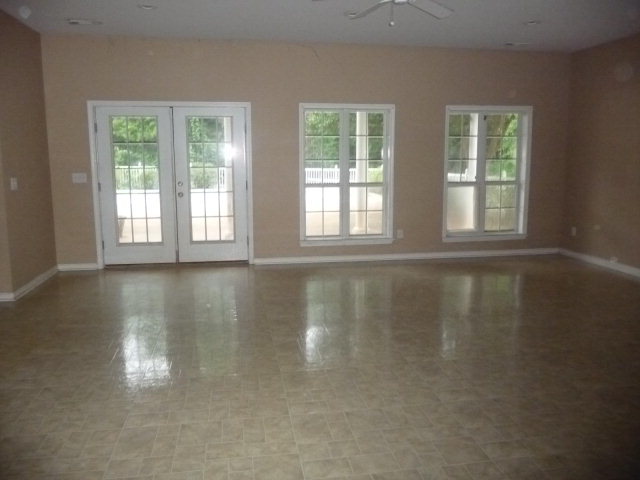 124 Rivoli Ridge Drive Macon, GA 31210 - Photo 14 of 17 a view of empty room with wooden floor and fan