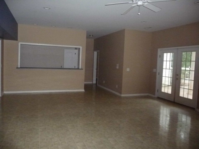 124 Rivoli Ridge Drive Macon, GA 31210 - Photo 16 of 17 an empty room with windows and entrance