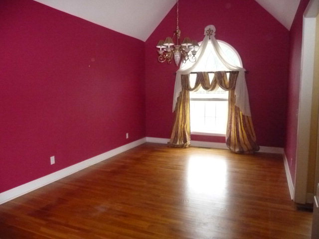 124 Rivoli Ridge Drive Macon, GA 31210 - Photo 5 of 17 a view of empty room with wooden floor and fan