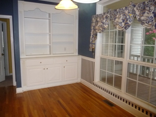 124 Rivoli Ridge Drive Macon, GA 31210 - Photo 7 of 17 a view of an empty room with wooden floor and a window