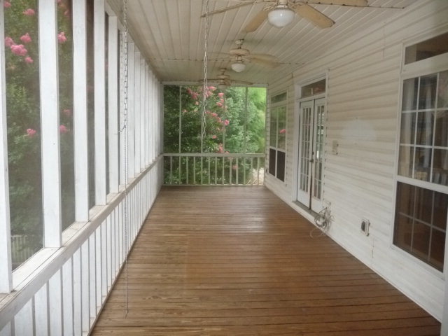 124 Rivoli Ridge Drive Macon, GA 31210 - Photo 10 of 17 a view of a porch with wooden floor and stairs