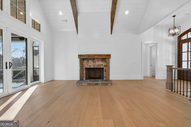 a kitchen with kitchen island a sink appliances and a counter top space