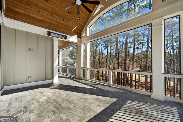 a kitchen with white cabinets and a stove