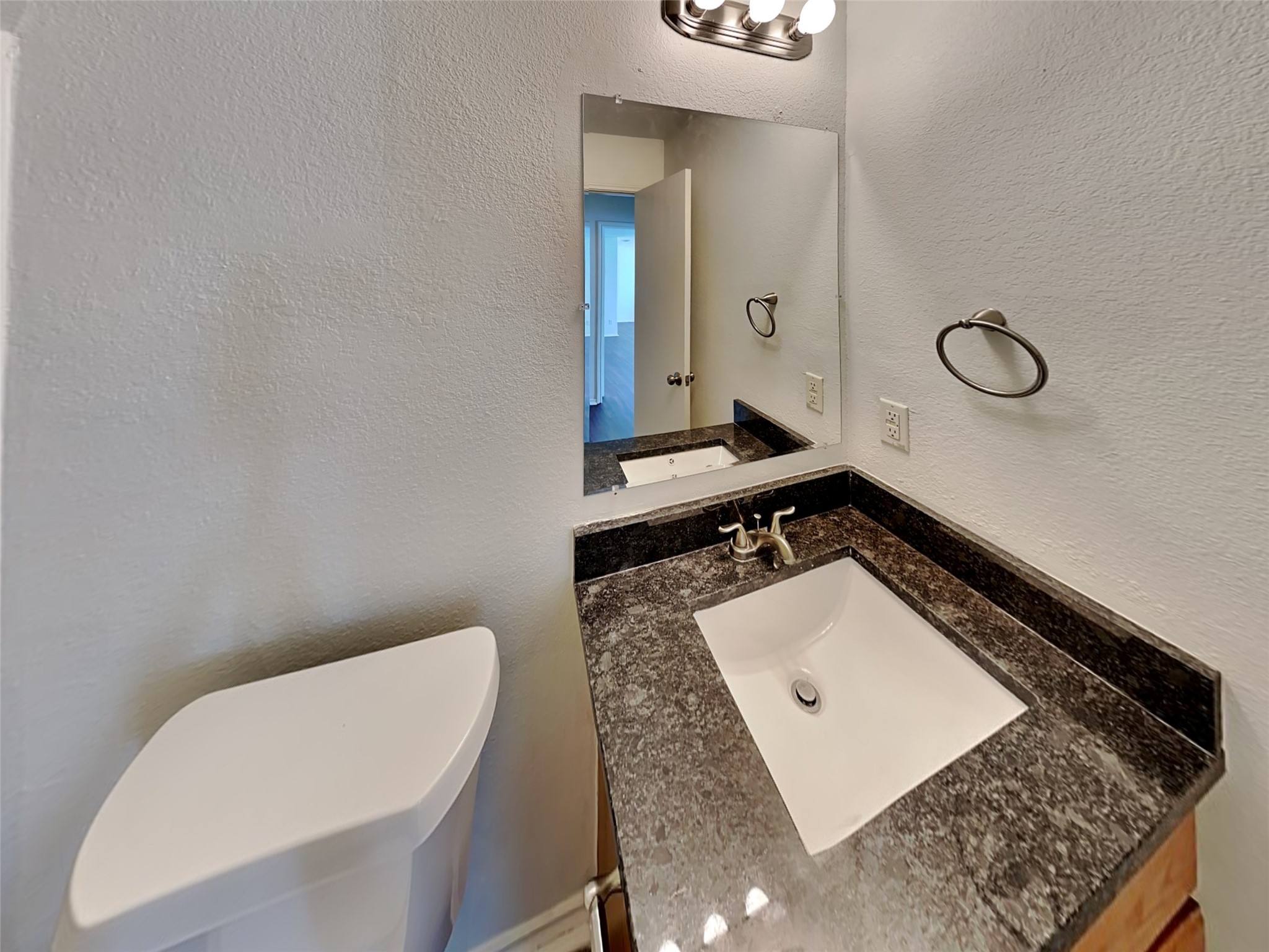 20930 Baronsledge Lane Katy, TX 77449 - Photo 19 of 21 a bathroom with a sink a toilet and mirror