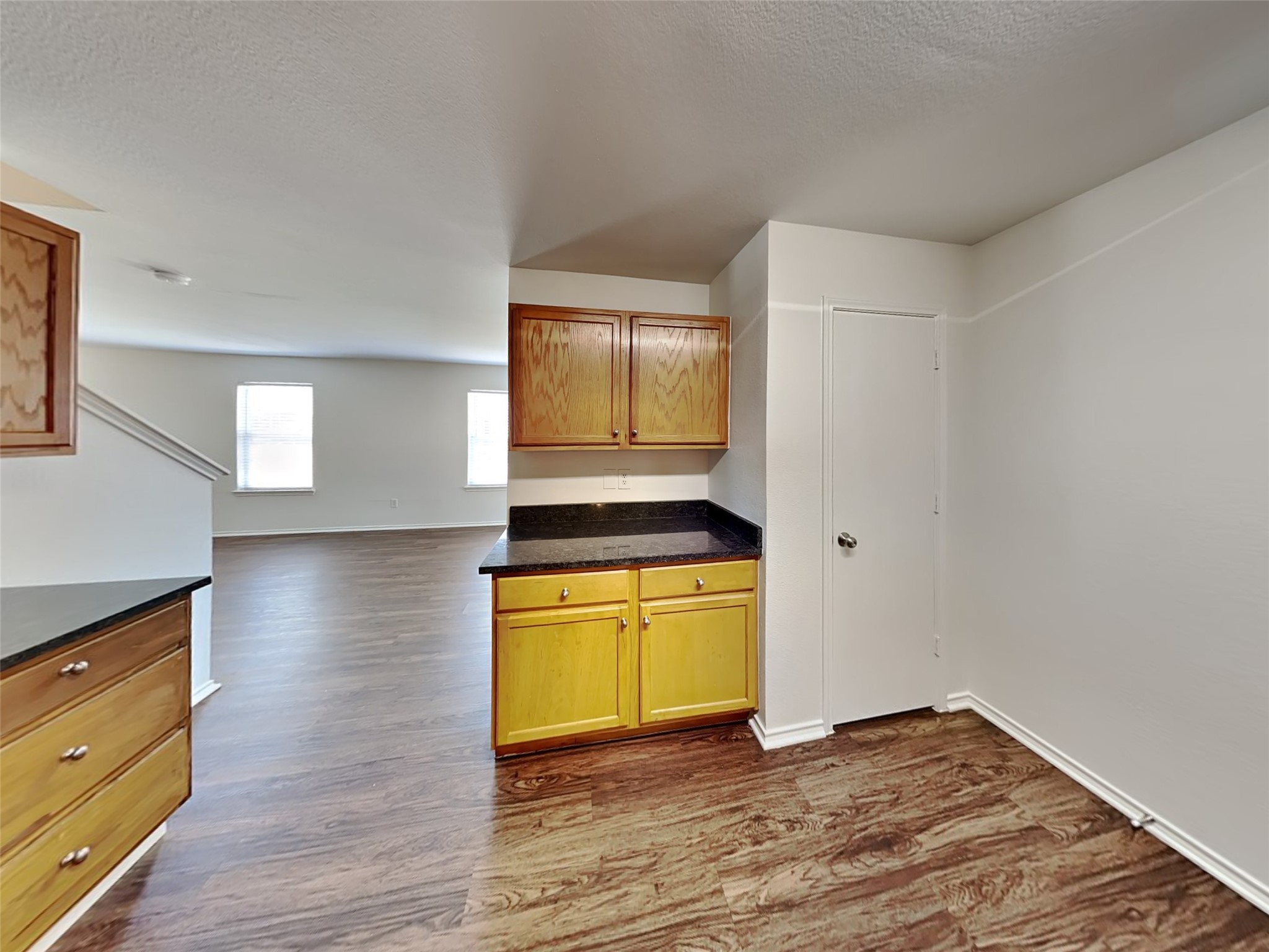 20930 Baronsledge Lane Katy, TX 77449 - Photo 3 of 21 a view of a room with wooden floor and cabinet