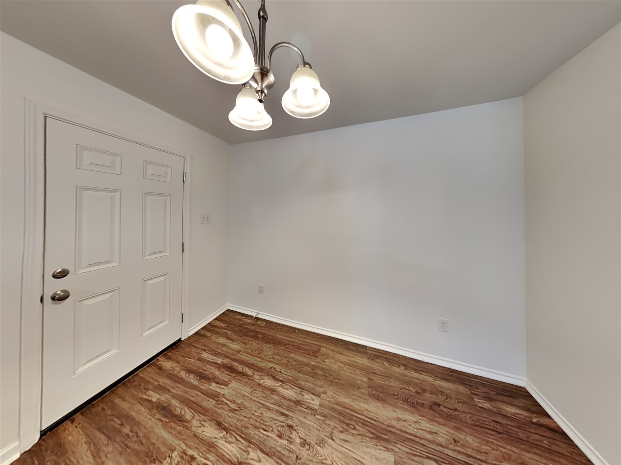20930 Baronsledge Lane Katy, TX 77449 - Photo 7 of 21 a view of a room with wooden floor and white walls