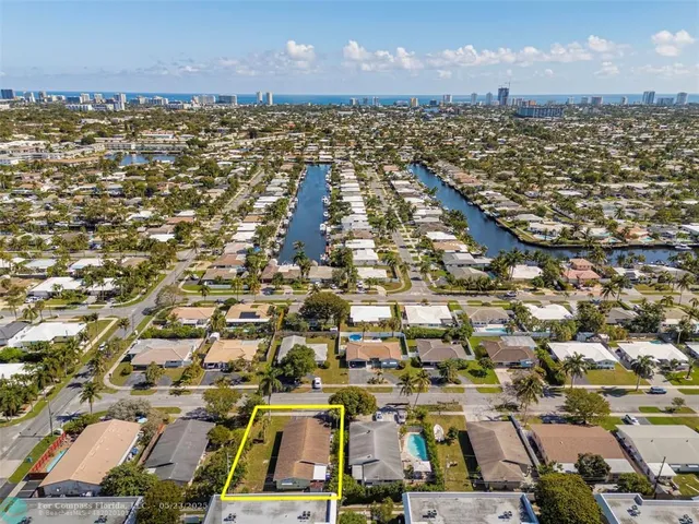 an aerial view of a city with parking