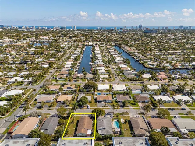 an aerial view of a city with parking