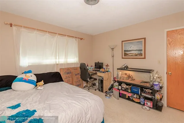 a bedroom with a bed a desk and chair