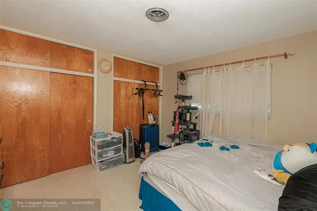 a bedroom with bed and a window