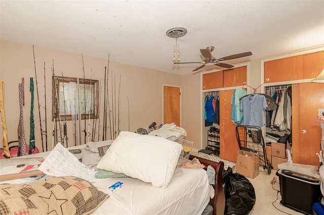 a bed room with a bed and a walk in closet