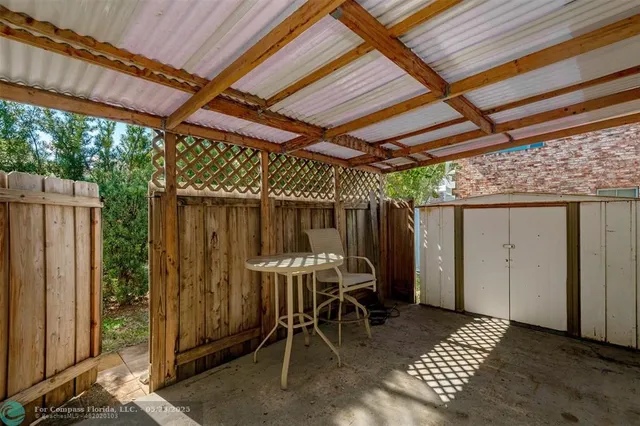 a patio with table and chairs