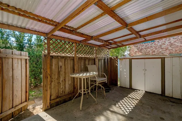 a patio with table and chairs