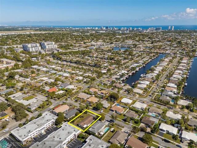 an aerial view of residential building and ocean