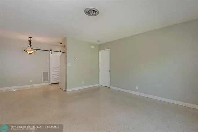 a view of a room with an empty space