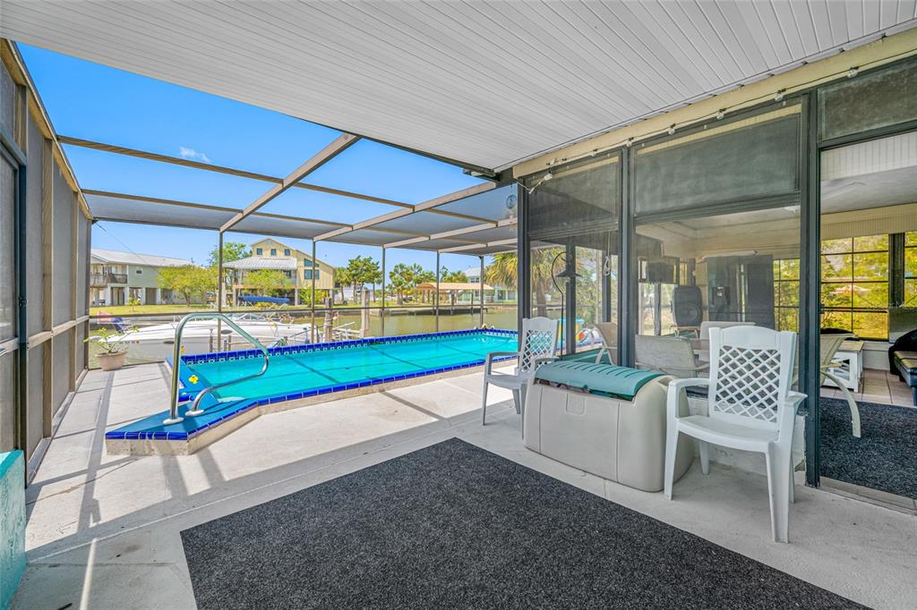 4124 Pine Dale Court Hernando Beach, FL 34607 - Photo 13 of 19 a white bench sitting in front of a building