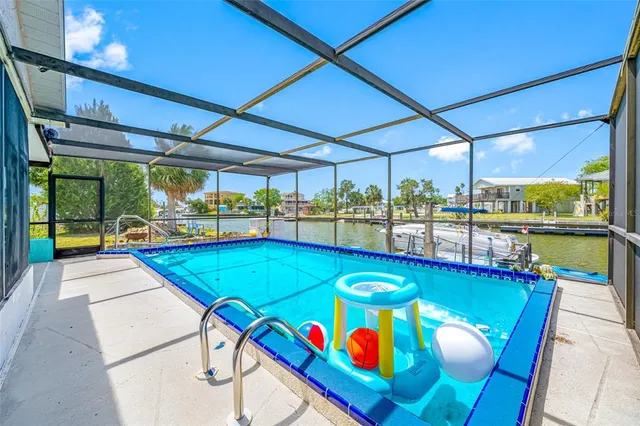 a view of a dining room with furniture wooden floor and windows