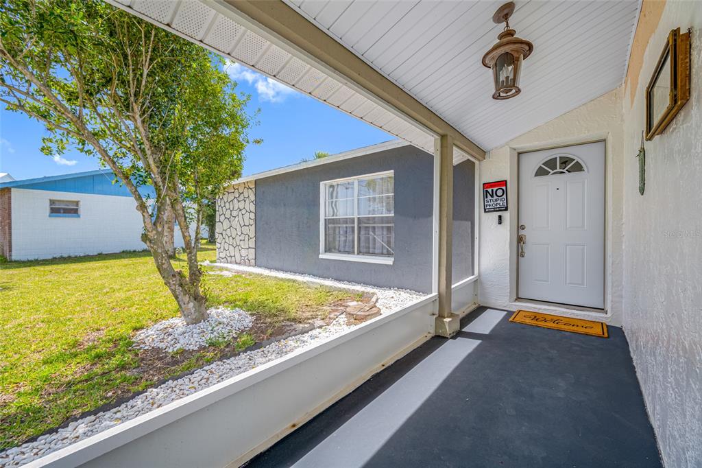 4124 Pine Dale Court Hernando Beach, FL 34607 - Photo 15 of 19 a front view of a house with garden