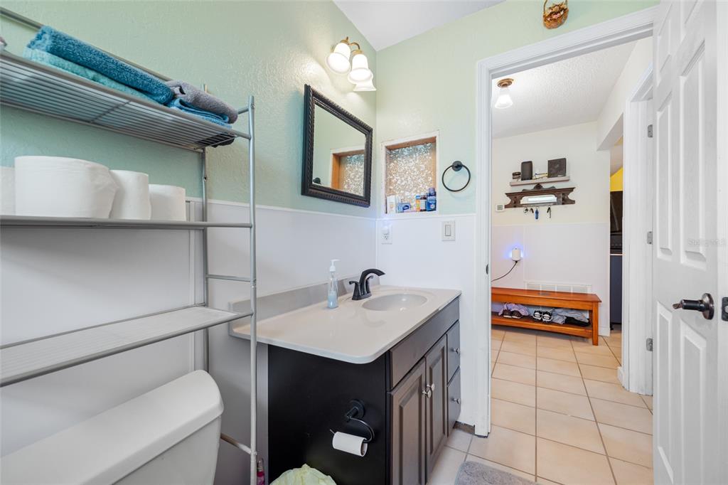 4124 Pine Dale Court Hernando Beach, FL 34607 - Photo 4 of 19 a bathroom with a sink and a mirror