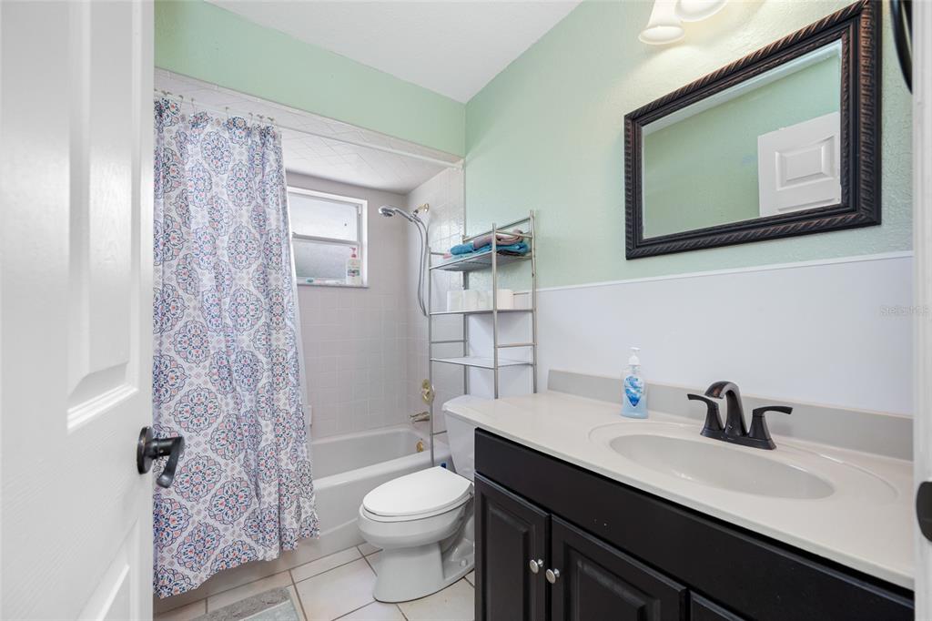 4124 Pine Dale Court Hernando Beach, FL 34607 - Photo 6 of 19 a bathroom with a toilet a sink and mirror