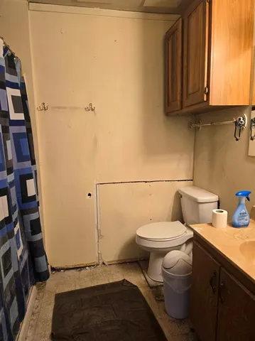 a bathroom with a toilet and a sink