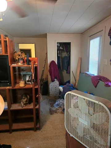 a bedroom with furniture and a window