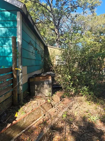 a view of a backyard of the house