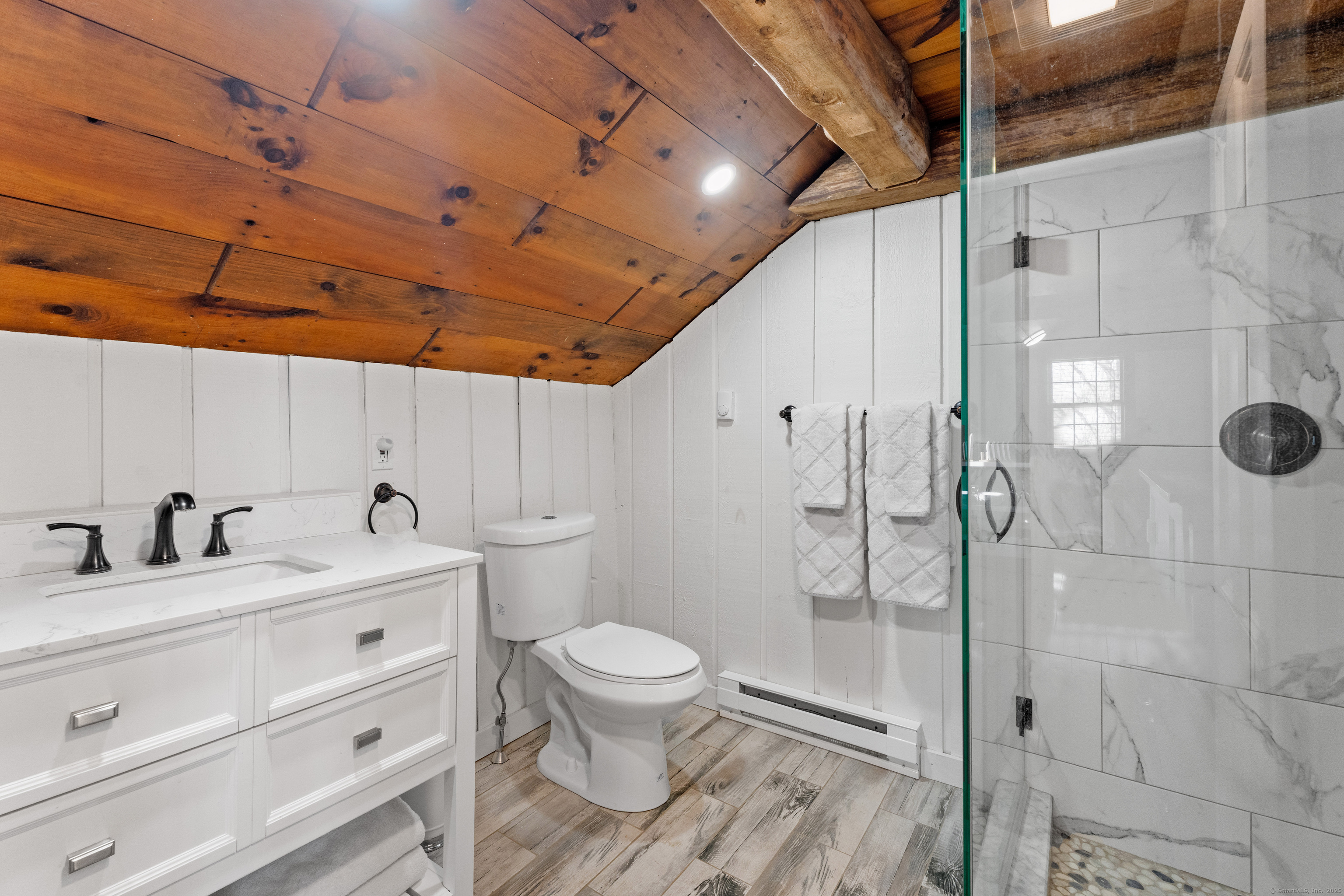 26 Old Wallingford Road Durham, CT 06422 - Photo 28 of 38 a bathroom with a granite countertop sink a toilet and shower