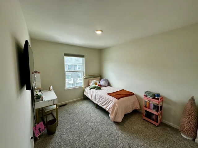 a room with furniture and a flat screen tv