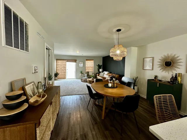 a view of a dining room with furniture and wooden floor