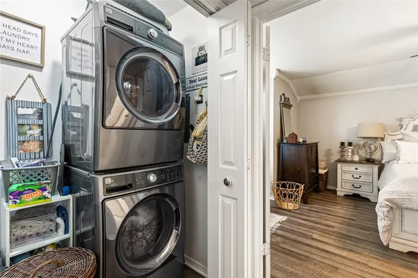 a view of a storage and utility room with washer and dryer