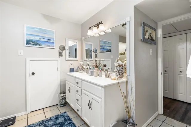 a bathroom with a sink a mirror and a shower