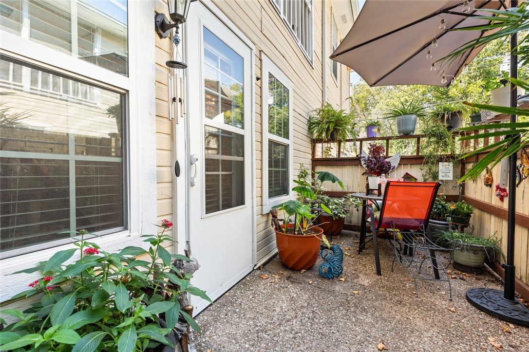 3813 Kimberly Drive, Unit B1 Waco, TX 76708 - Photo 28 of 30 a view of a patio with table and chairs and potted plants