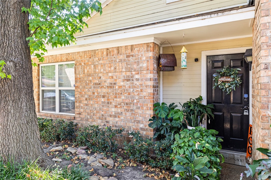 3813 Kimberly Drive, Unit B1 Waco, TX 76708 - Photo 3 of 30 a couple of potted plants in front of door