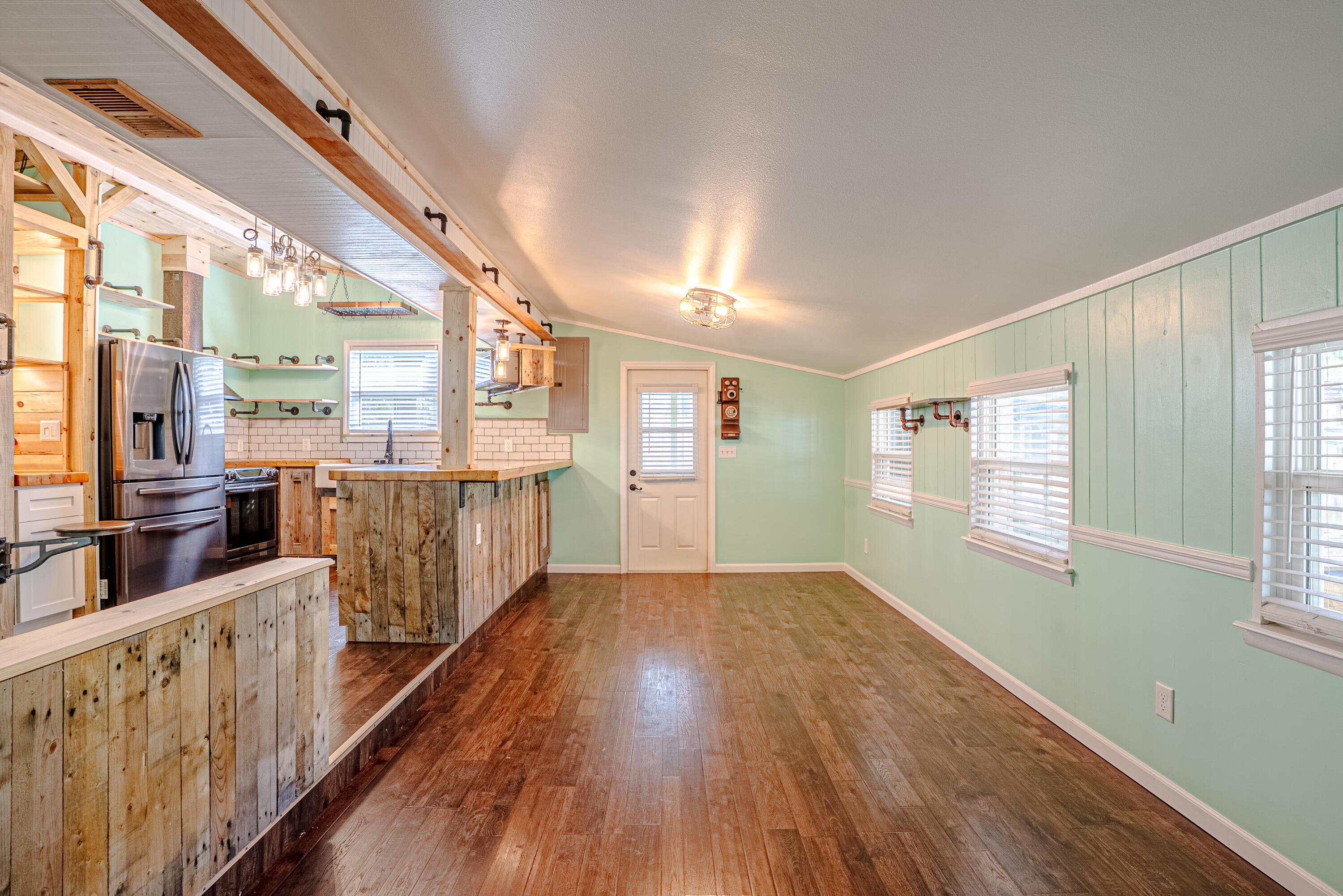 85 Our Street Vernon, FL 32462 - Photo 12 of 66 a view of a kitchen with wooden floor and windows