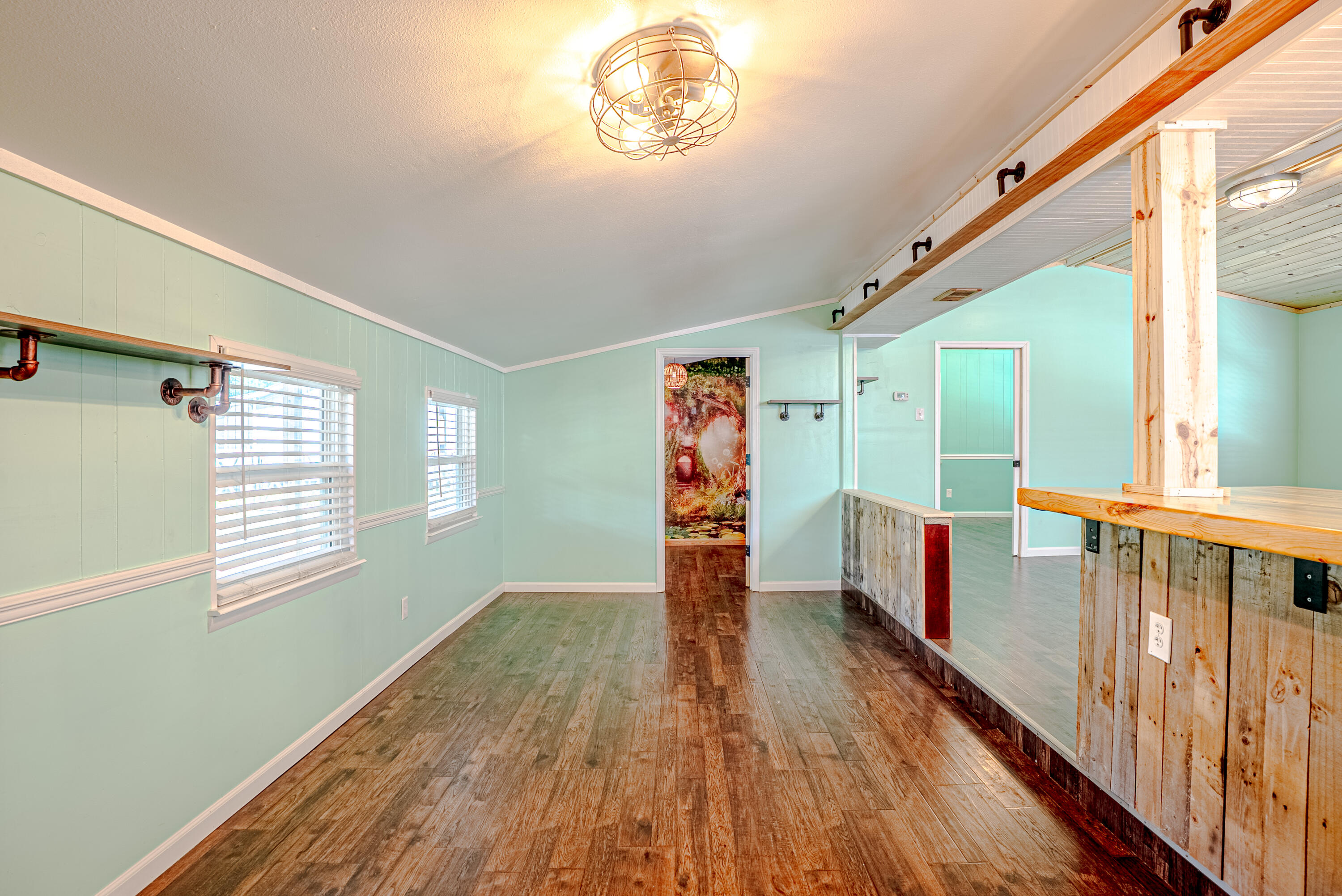 85 Our Street Vernon, FL 32462 - Photo 14 of 66 a view of empty room with wooden floor and fan