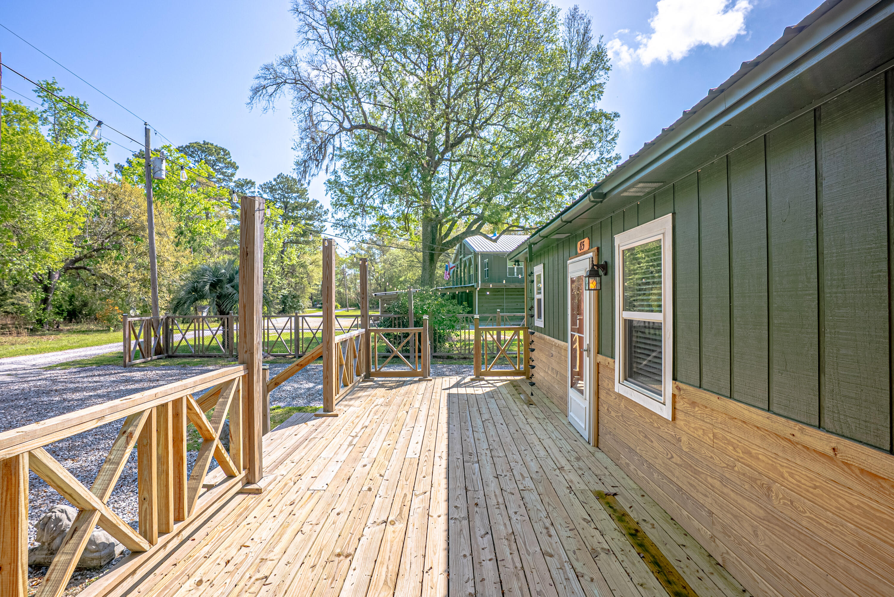 85 Our Street Vernon, FL 32462 - Photo 22 of 66 a view of a balcony with wooden floor and outdoor space
