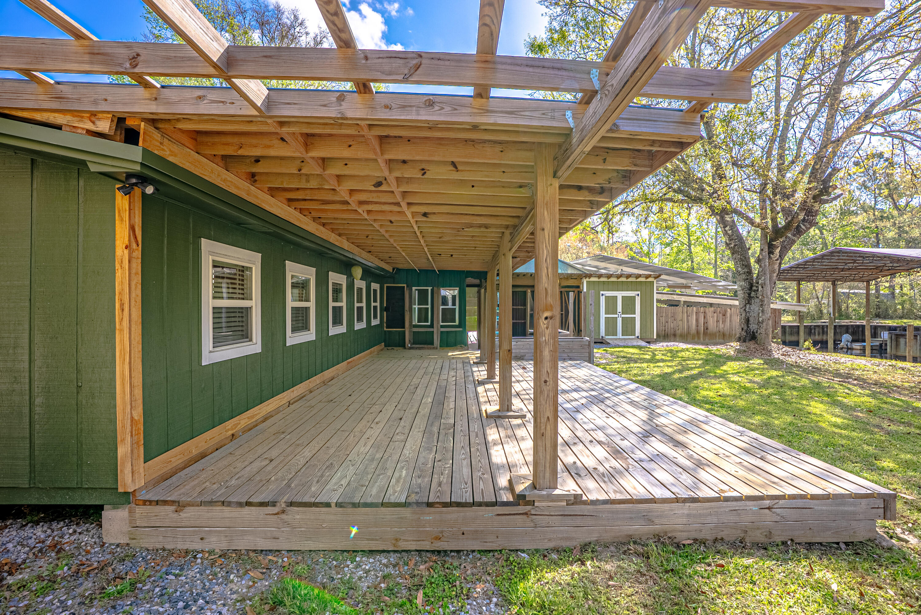 85 Our Street Vernon, FL 32462 - Photo 32 of 66 a view of a house with backyard and sitting area