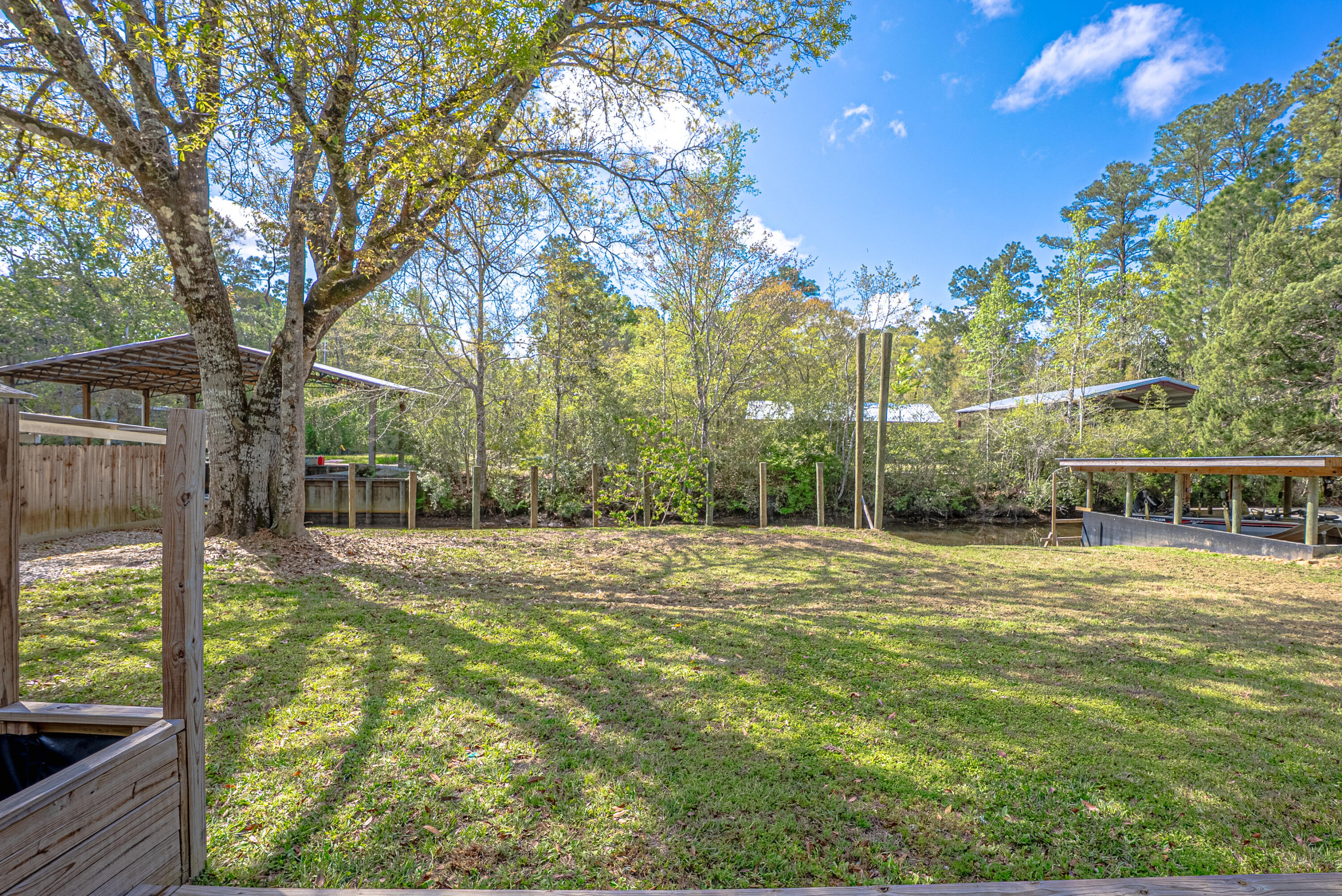 85 Our Street Vernon, FL 32462 - Photo 35 of 66 a backyard of a house with table and chairs