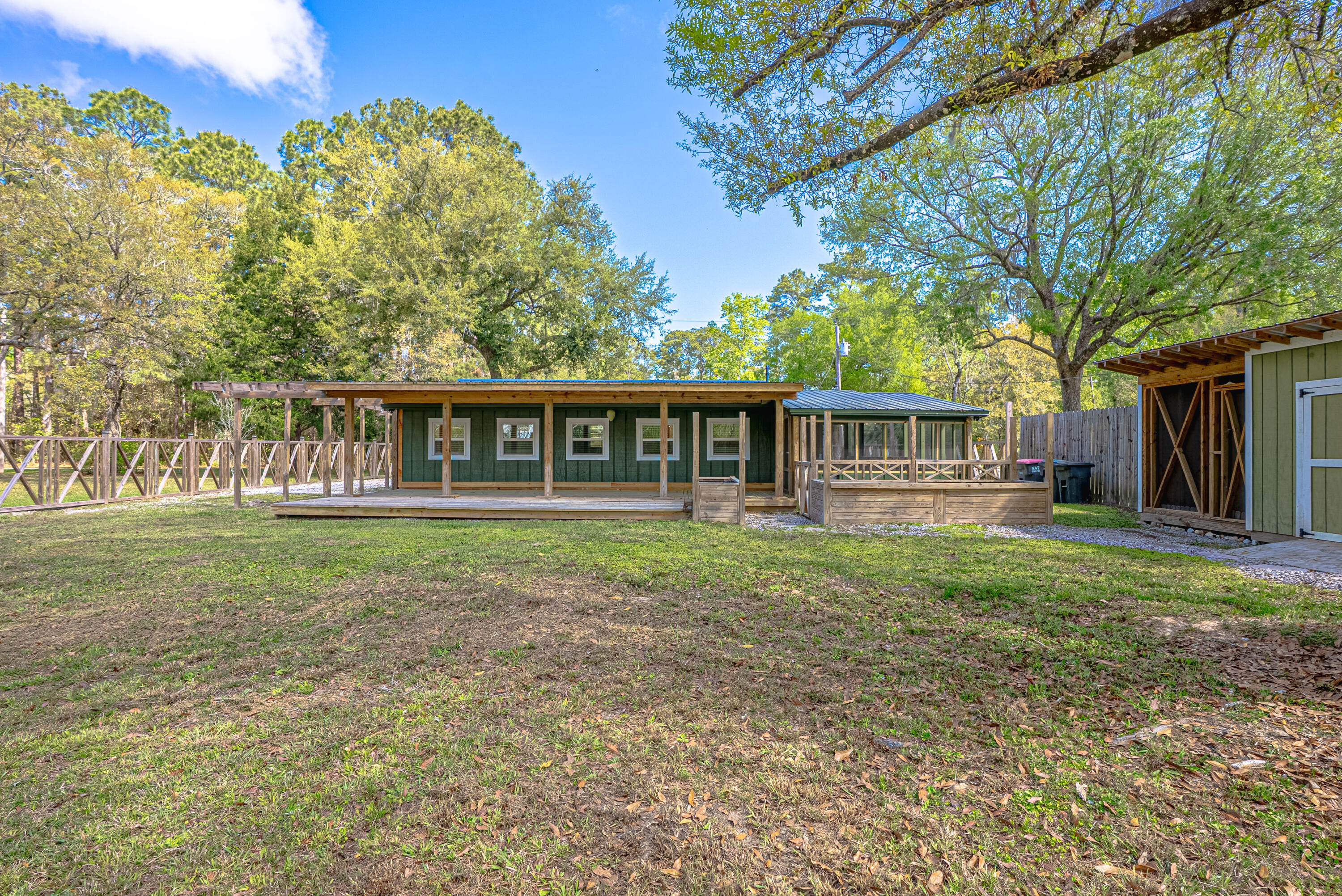 85 Our Street Vernon, FL 32462 - Photo 37 of 66 a view of a house with backyard and porch