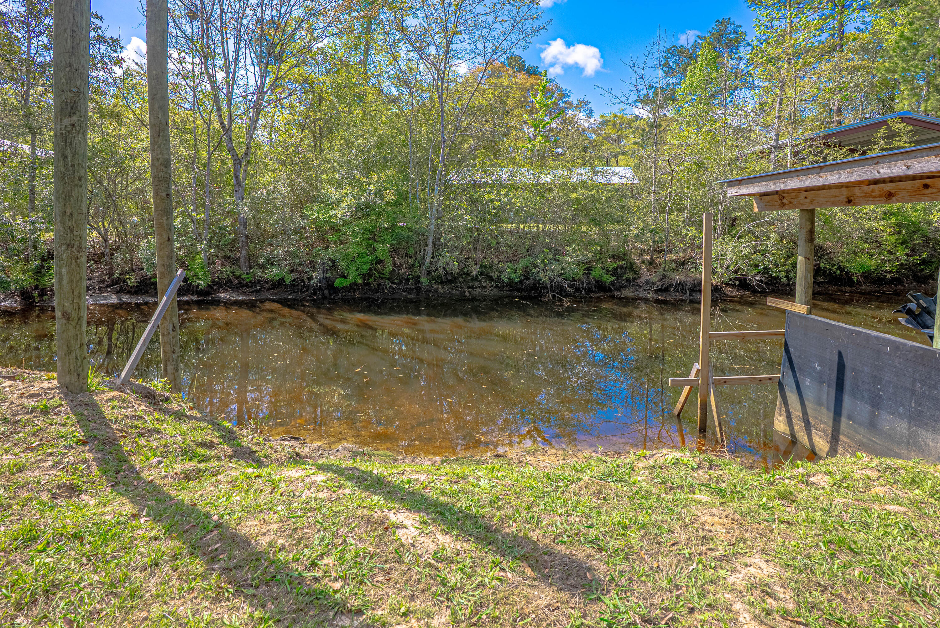 85 Our Street Vernon, FL 32462 - Photo 39 of 66 a view of a lake with a large trees