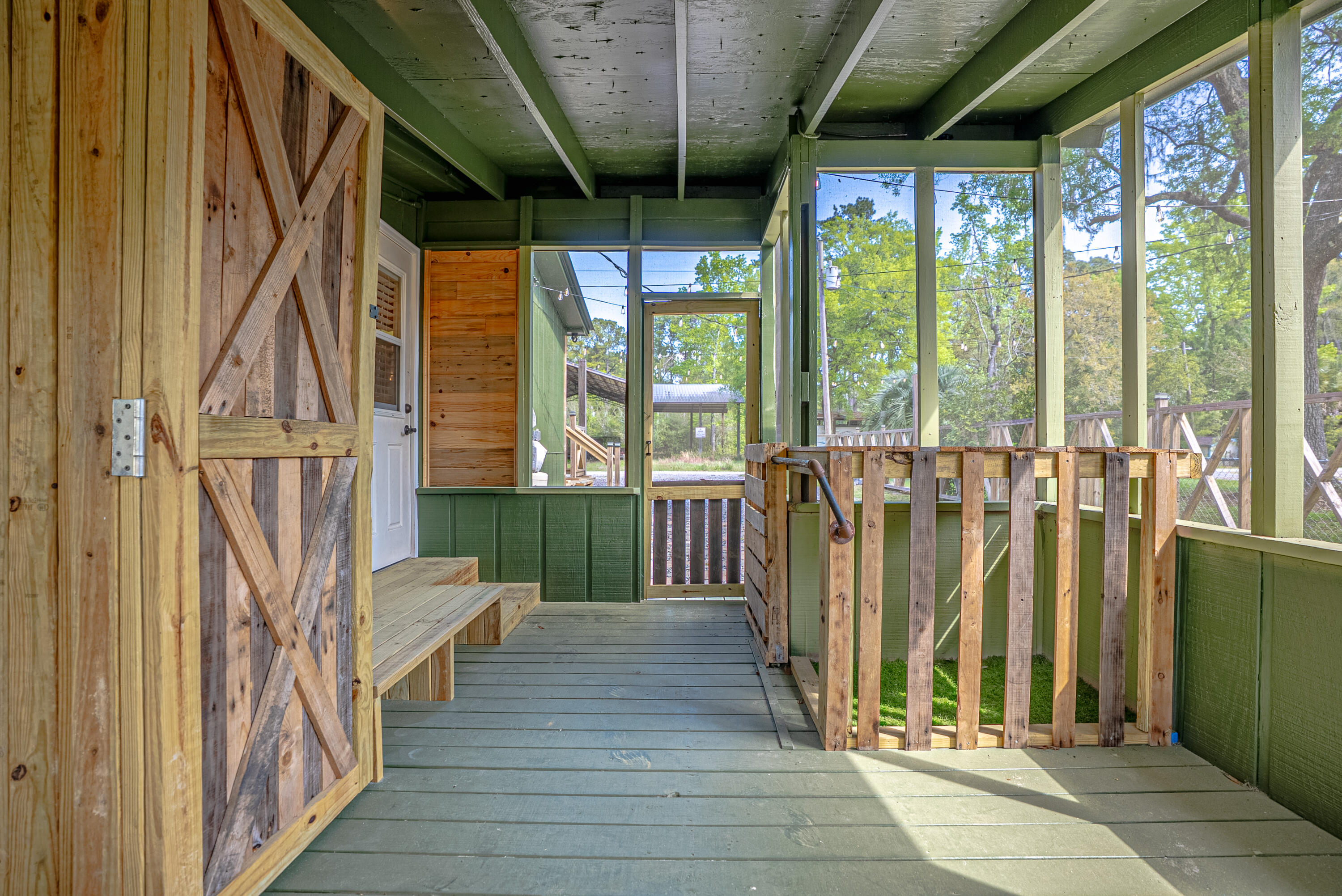 85 Our Street Vernon, FL 32462 - Photo 42 of 66 a view of a balcony with wooden floor