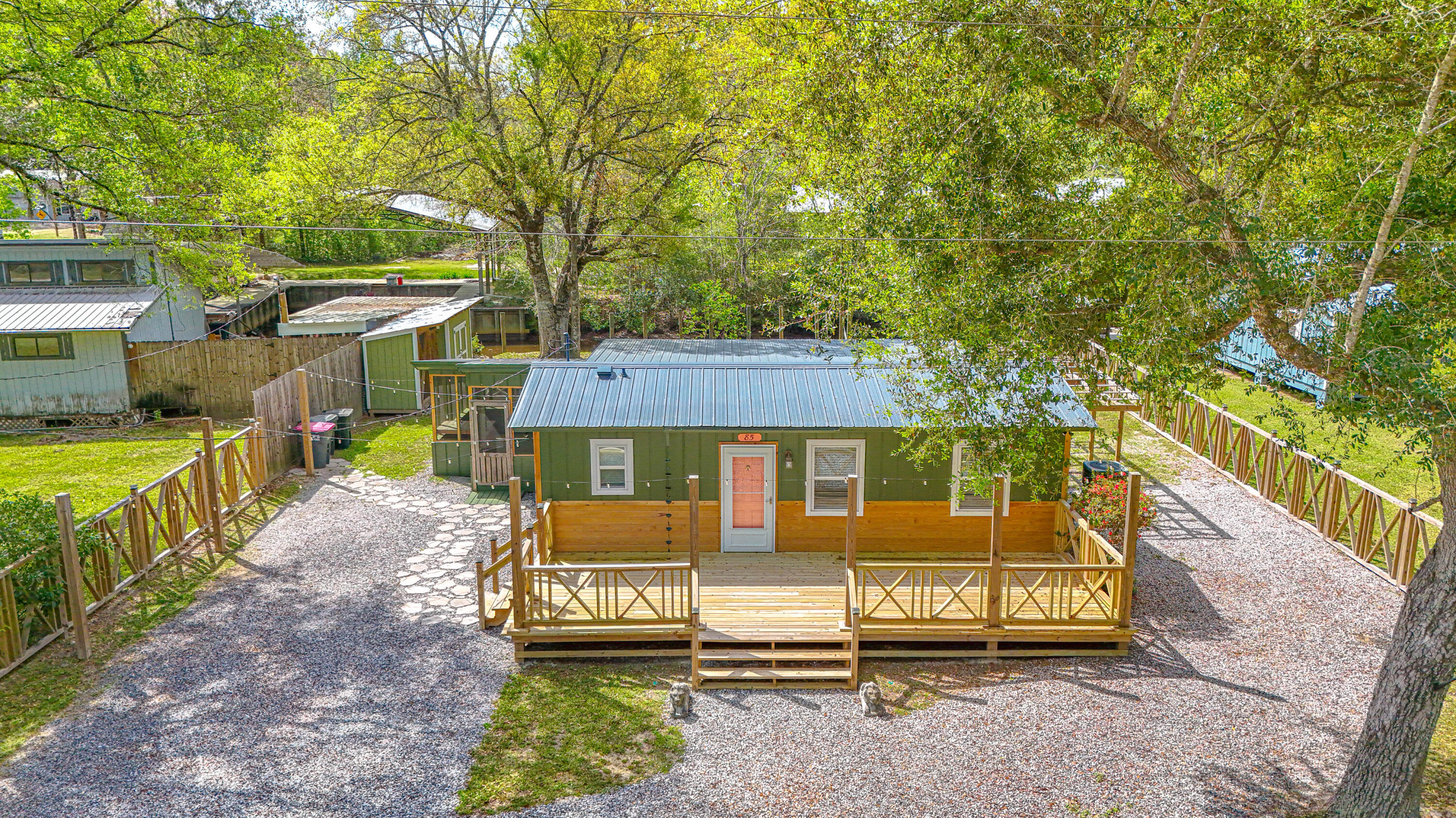 85 Our Street Vernon, FL 32462 - Photo 47 of 66 a view of a house with a yard
