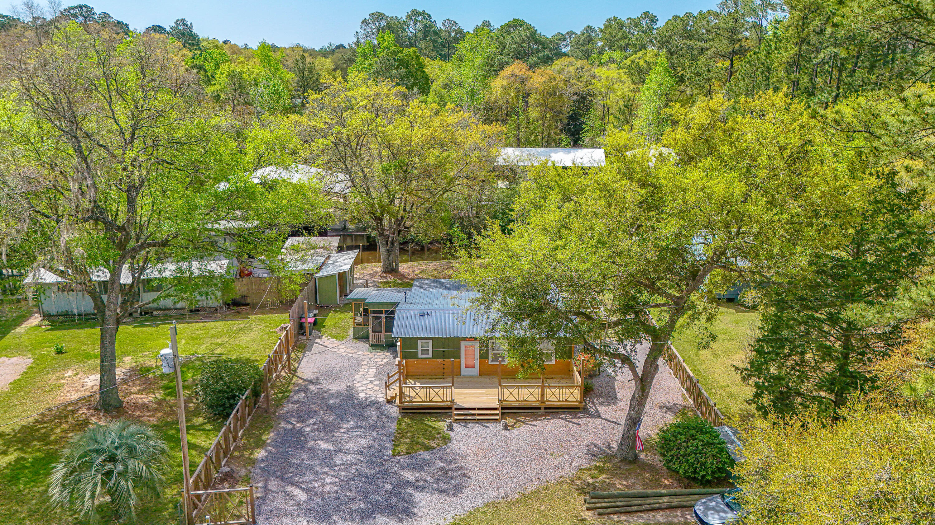 85 Our Street Vernon, FL 32462 - Photo 49 of 66 a front view of a house with a yard