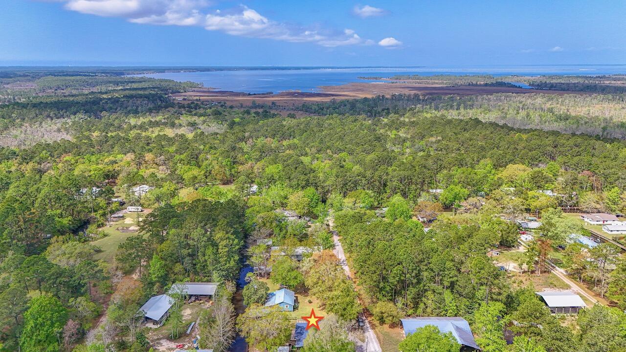 85 Our Street Vernon, FL 32462 - Photo 54 of 66 a view of a yard with an outdoor space