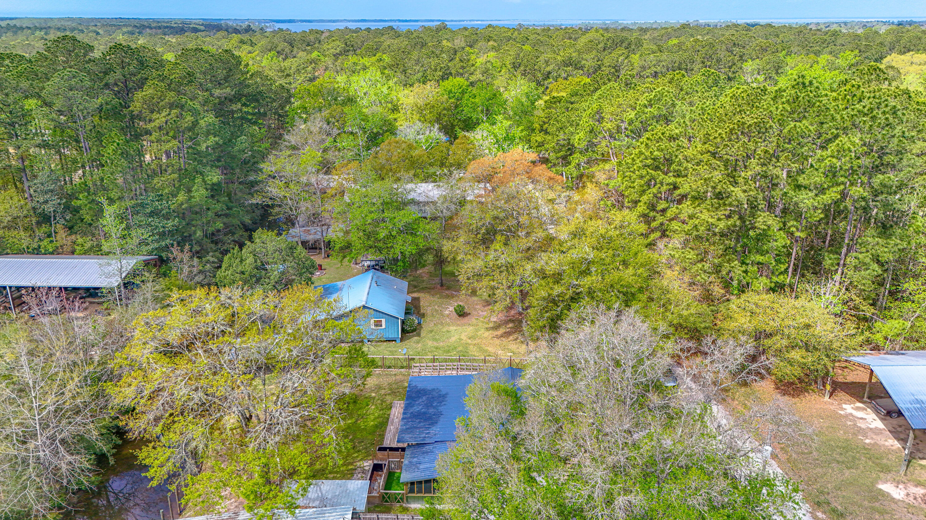 85 Our Street Vernon, FL 32462 - Photo 56 of 66 an aerial view of residential houses with yard
